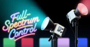 Two studio lights on tripods, one shining blue and the other red, with neon-style text reading "Full-Spectrum Control" and colorful gradient bars in the background.