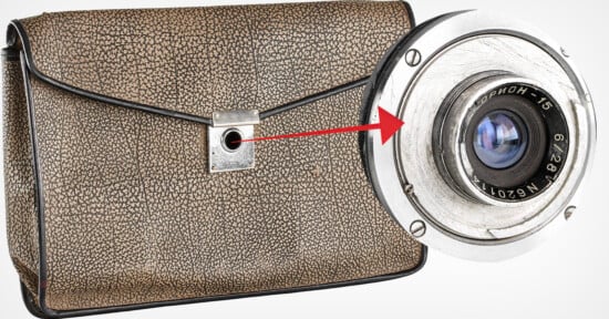 A vintage, textured brown handbag with a hidden camera lens revealed behind a flap, highlighted by a red arrow pointing from the bag’s clasp to the close-up of the camera lens.
