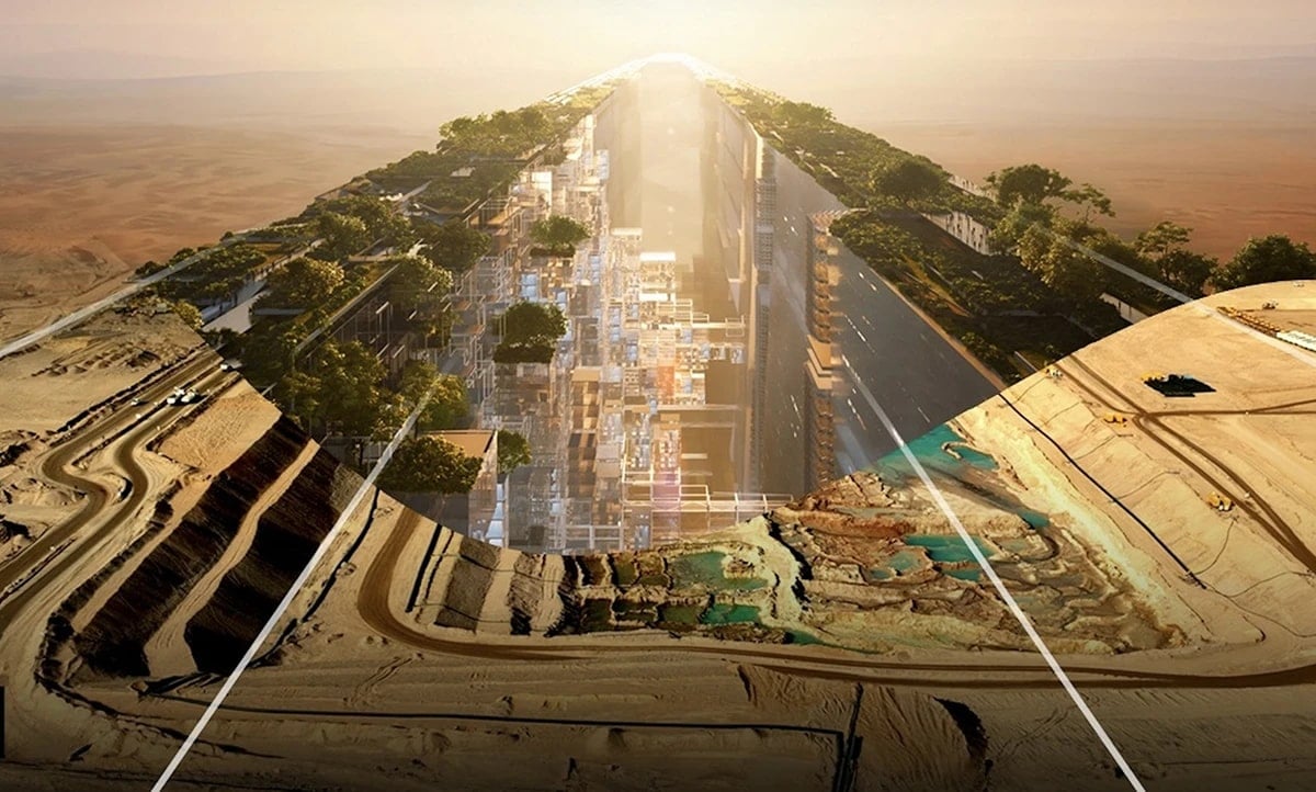 Futuristic concept art showing a mirrored linear city cutting through a desert landscape, with green trees on top, geometric architecture inside, and construction work in the foreground.