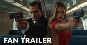 A man in a suit and a woman in a red dress sit side by side on a train, both aiming pistols forward with serious expressions. The words "FAN TRAILER" are displayed in bold white text at the bottom left.