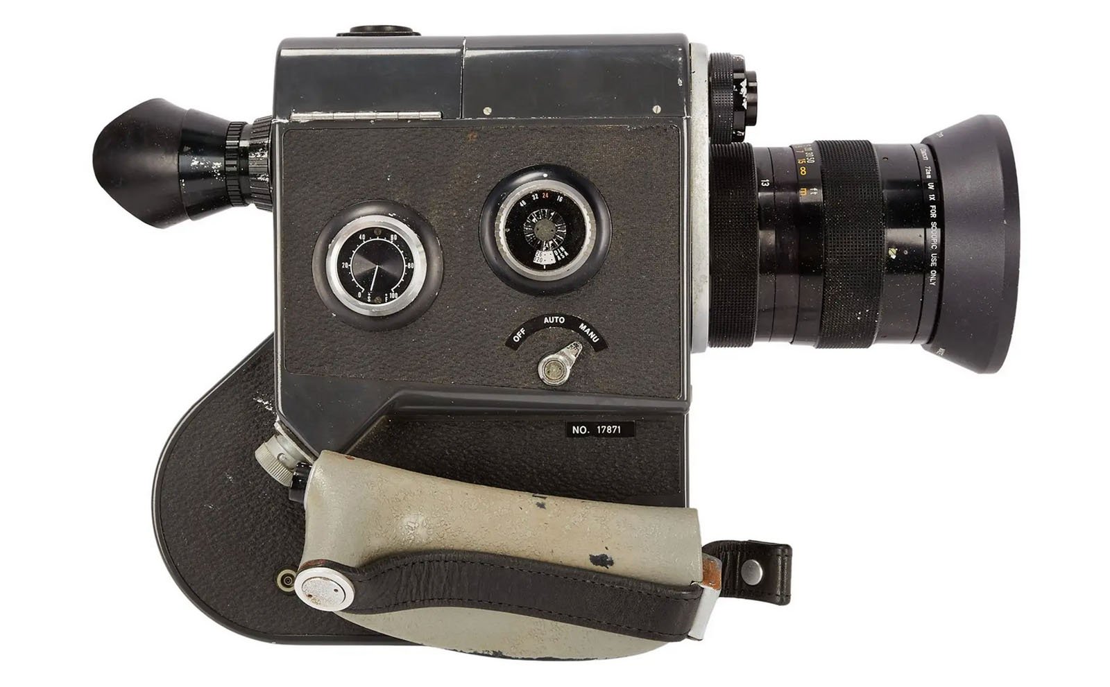 A vintage black and silver film camera with a large lens, viewfinder, two dials, and a textured grip with a wrist strap, shown against a white background.