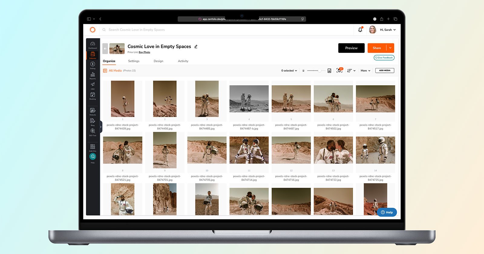 A laptop screen displays a photo-organizing app with images of astronauts in desert landscapes. The app shows folders, image thumbnails, and options to preview, share, and manage the project titled “Cosmic Love in Empty Spaces.”.