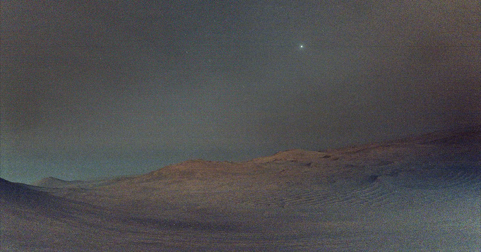 Perseverance Captures Martian Moon Shining in the Sky Before Sunrise