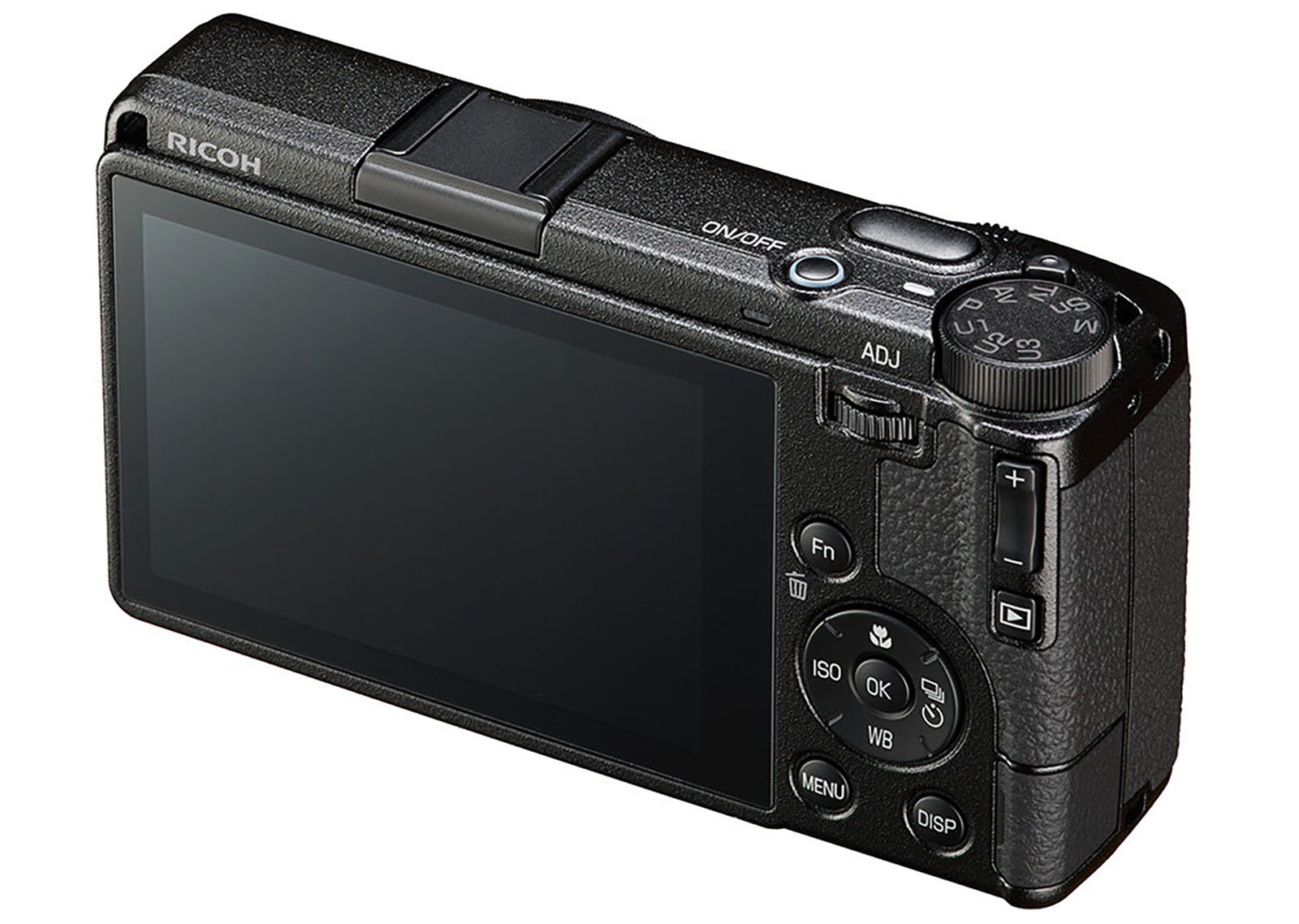 A digital camera with a large LCD screen, several buttons and dials on the back and top, and a textured black body. The brand "Ricoh" is visible on the upper left side.