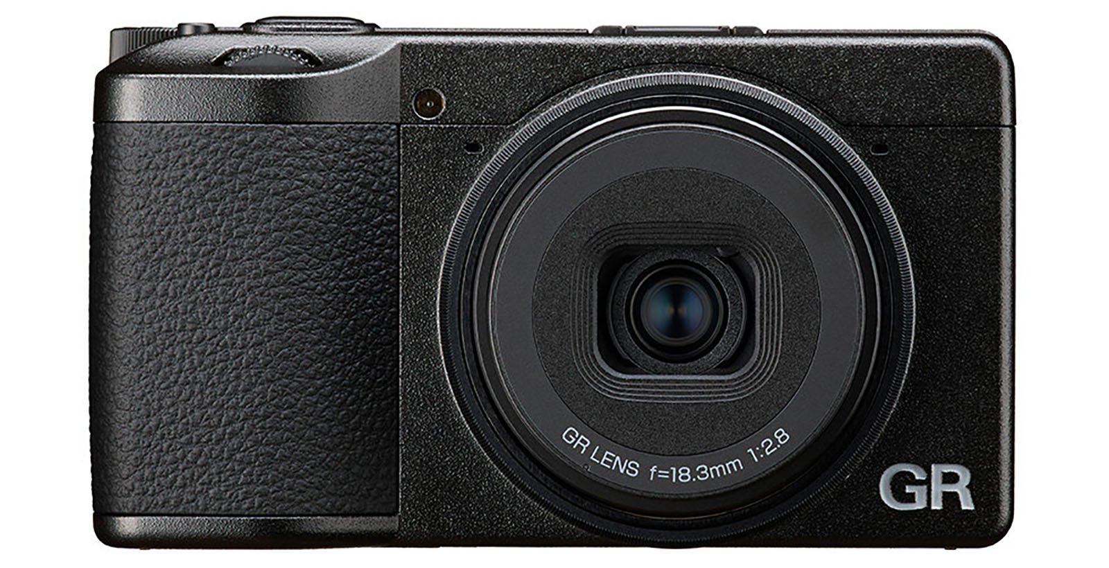 A black compact digital camera with a textured grip and a large central lens labeled "GR LENS f=18.3mm 1:2.8" on the front. The camera has "GR" printed in white text in the lower right corner.