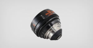 A Zeiss Supreme Prime 40mm camera lens with black and silver casing, orange and white text labeling, shown against a plain light gray background.