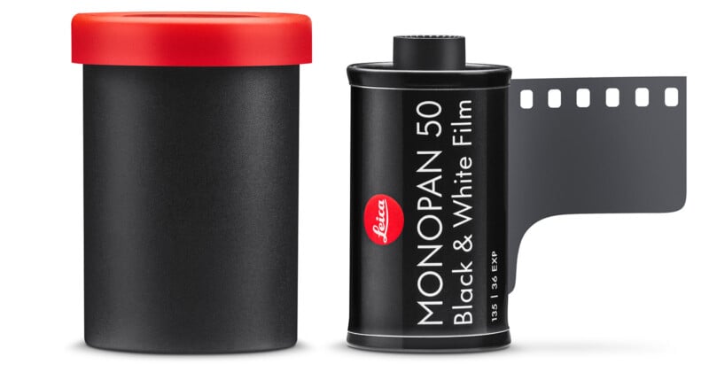 A black Leica MONOPAN 50 black and white film canister with a strip of film extended, shown next to a black film container with a red lid.