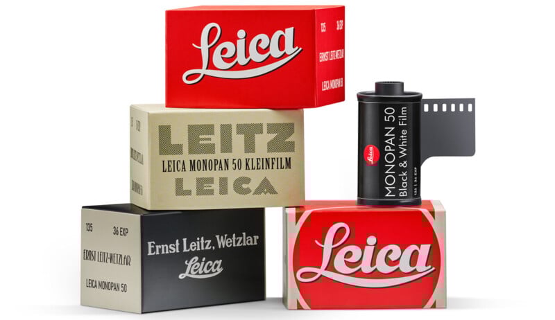 A stack of Leica film boxes in red, beige, and gray colors surrounds a Leica Monochrome 50 black and white film canister with film unspooled, displaying the Leica logo on the packaging.