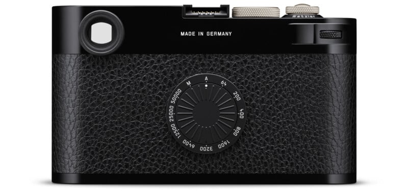 A black, vintage-style camera with a textured leather back, dials, and controls. The words "MADE IN GERMANY" are printed on the top center. No visible LCD screen.