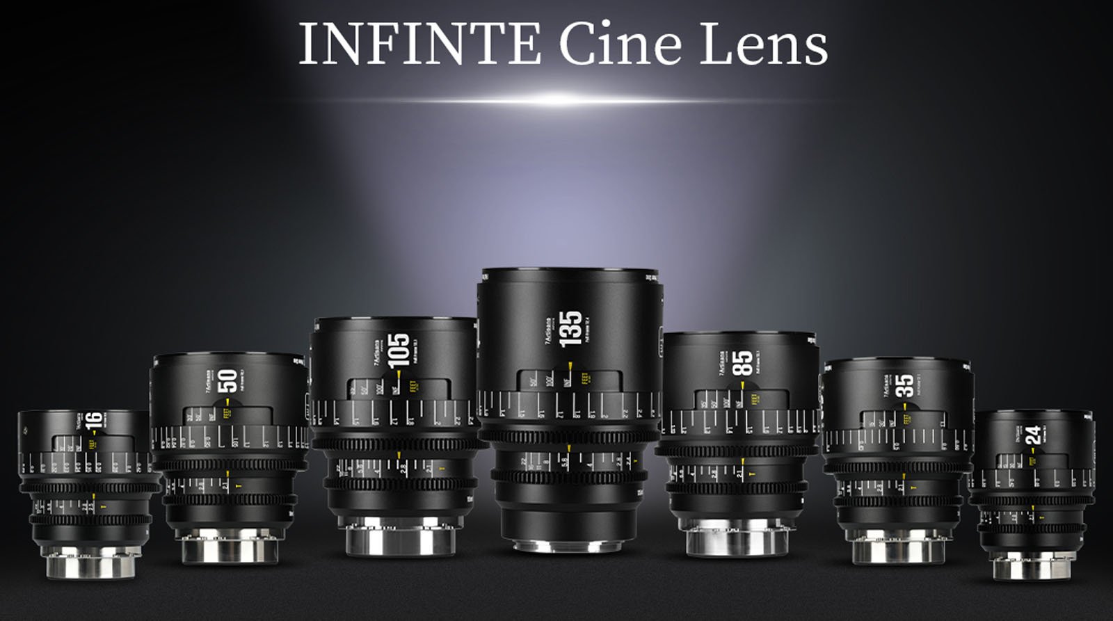 A lineup of seven cine camera lenses of varying sizes and focal lengths displayed upright on a dark surface with "INFINITE Cine Lens" text above, illuminated by a spotlight.