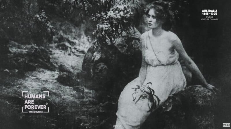 A woman in a light, flowing dress sits on a rock in a natural, wooded setting. The image is in black and white and has a vintage, early 1900s appearance. Text reads "HUMANS ARE FOREVER" and "AUSTRALIA 1848–1925.