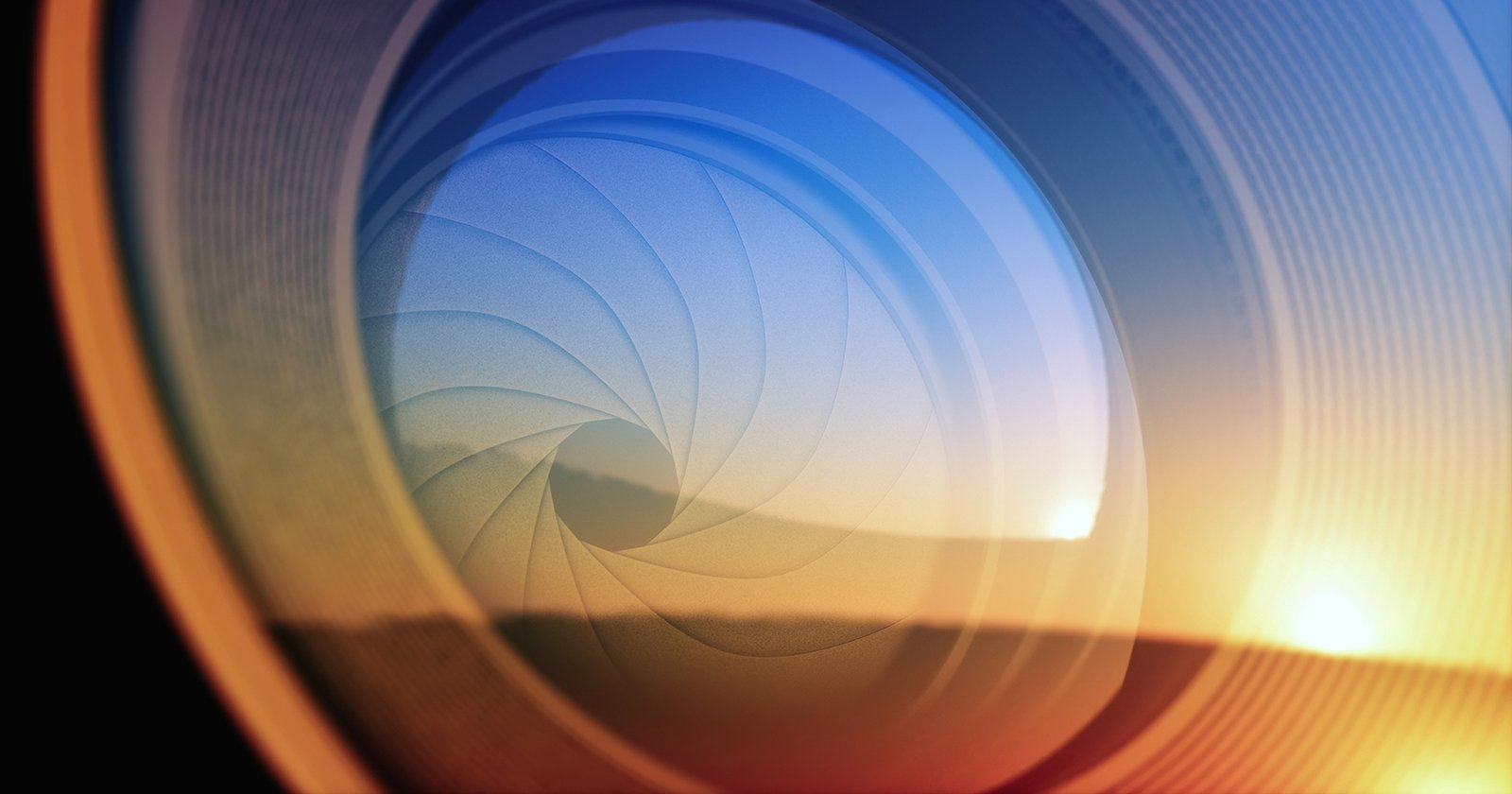 Close-up of a camera lens with sunlight reflecting off the glass, showing the intricate details of the aperture blades and a warm, golden sky in the background.