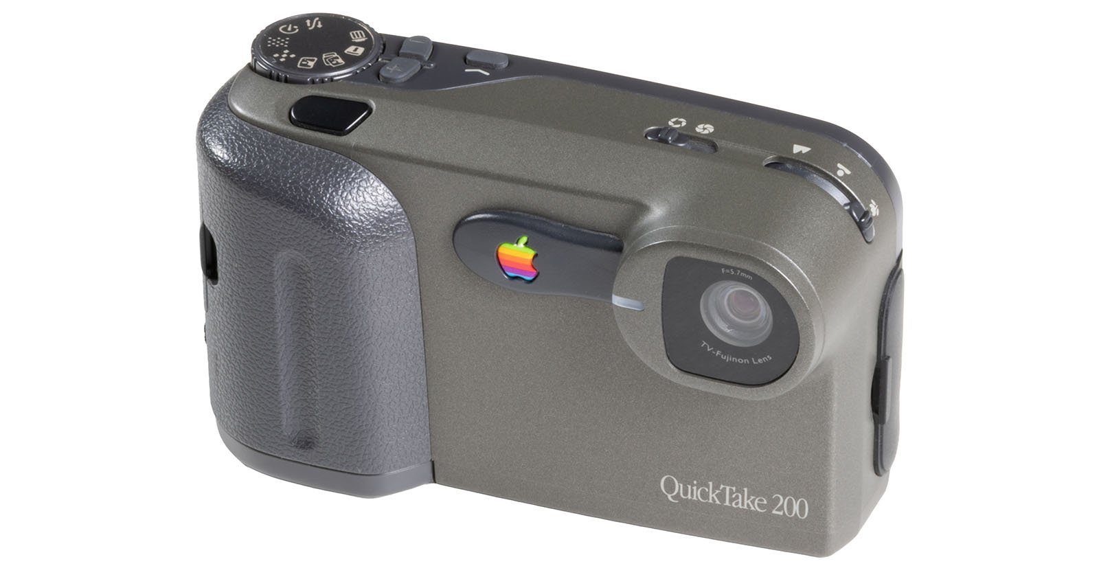 A vintage Apple QuickTake 200 digital camera with a gray body, a textured black grip, a lens on the front, and a rainbow Apple logo beside the lens.