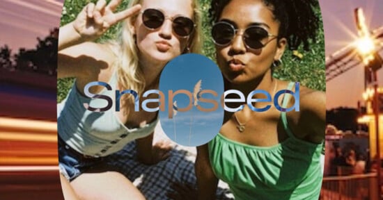 Two women wearing sunglasses pose for a selfie outdoors on grass, one making a peace sign. The word "Snapseed" is overlaid on the image with a sky and grass graphic inside the letters.