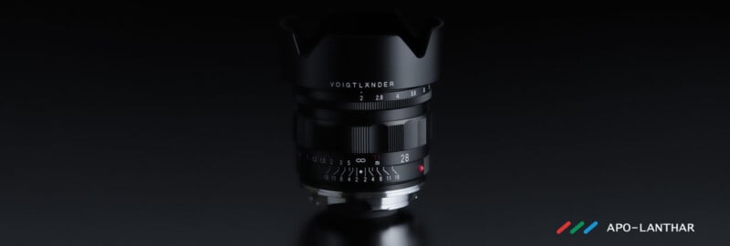 A Voigtländer APO-LANTHAR camera lens stands upright on a dark reflective surface, illuminated by soft lighting, with the brand logo and name "APO-LANTHAR" in the lower right corner.