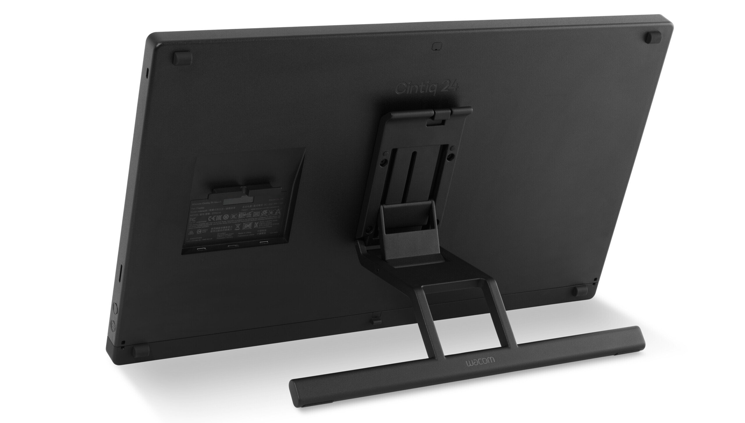 A black drawing monitor viewed from the back, featuring an adjustable stand and a wide support bar, with the brand name Wacom visible on the lower part of the stand.