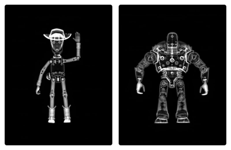 X-ray images of two toy figures: on the left, a cowboy doll with a hat and one arm raised; on the right, a bulky robot with visible gears and mechanical parts, both shown on a black background.