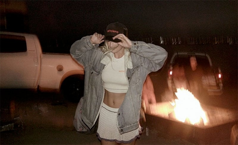 A woman wearing a hat and jacket.