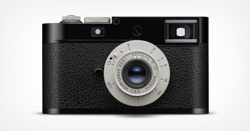 A black and silver vintage-style camera with a textured grip, a round lens in the center, and a viewfinder on the top right side against a plain white background.