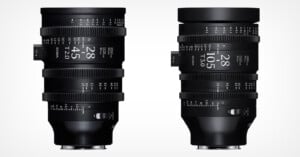 Two professional black camera lenses with white text and measurement markings are shown upright against a white background. The lens on the left is labeled 28-45mm T2.0, and the lens on the right is labeled 28-105mm T3.0.