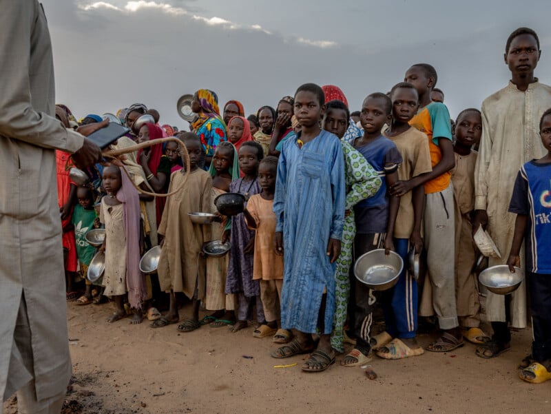 A group of people standing in a line.