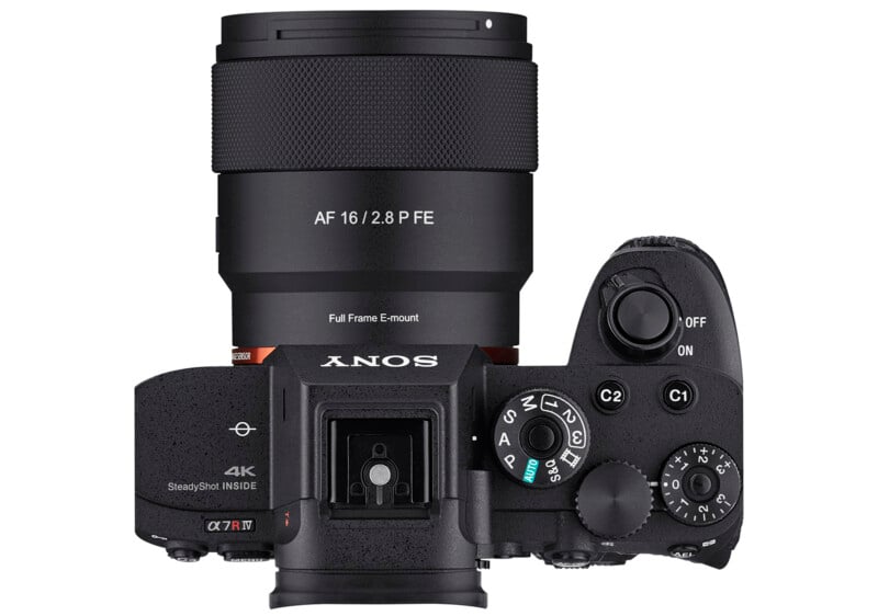 Top view of a black Sony digital camera with a mounted AF 16mm f/2.8 lens, showing buttons, dials, viewfinder, and on/off switch. The camera body features labeling for 4K video and SteadyShot.