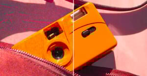 A bright orange camera, half shown in a close-up, peeks out from an unzipped red bag. The image is split vertically, with the left side appearing more textured and saturated than the right.