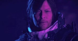 A close-up of a male character with shoulder-length hair and a serious expression, illuminated by purple and blue lighting, wearing a futuristic suit with visible armor and mechanical details.