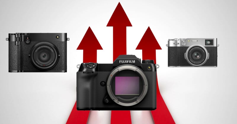 Three Fujifilm cameras are displayed with red upward arrows in the background, suggesting growth or advancement; the central camera is larger and prominently featured.