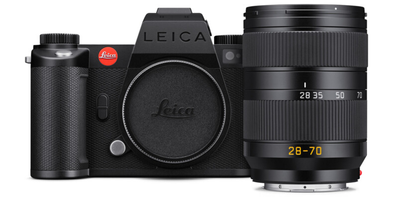 A black Leica camera body with the lens cap on, positioned next to a detached Leica 28-70mm zoom lens; both are displayed against a white background.