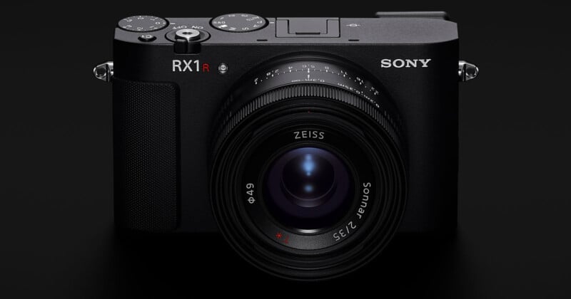 A black Sony RX1R camera with a Zeiss 35mm f/2 lens is shown facing forward on a dark background.