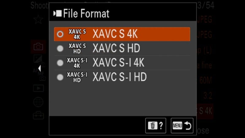 Camera menu screen displaying file format options: XAVC S 4K (selected), XAVC S HD, XAVC S-I 4K, and XAVC S-I HD. Navigation and menu icons appear at the bottom.