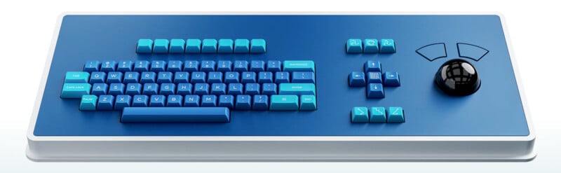 A blue, rectangular keyboard with teal keys, a set of arrow keys, function buttons, and a large black trackball with curved buttons on the right side, all on a sleek blue and white base.