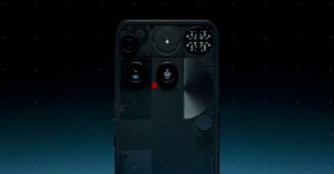 A smartphone with a transparent back reveals its internal components and lights, positioned against a dark, starry background. The phone's camera and intricate circuitry are prominently visible.