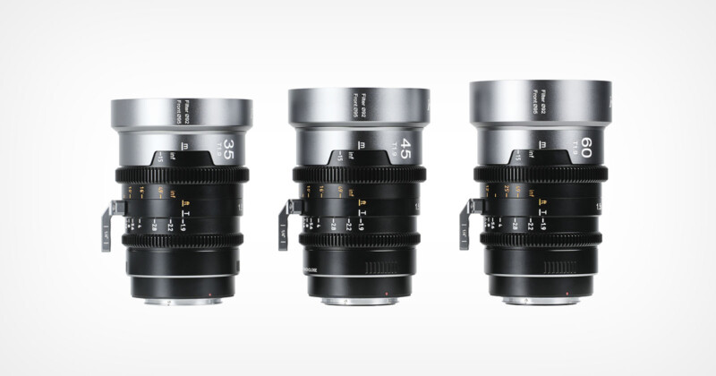 Three professional camera lenses with focal lengths of 35mm, 45mm, and 60mm are displayed upright side by side against a white background. The lenses feature focus and aperture rings with labeled markings.