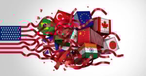 Shipping containers with various country flags, including the US, UK, China, India, Brazil, Canada, Japan, and the EU, surrounded by red ribbons, symbolizing international trade and global connections.