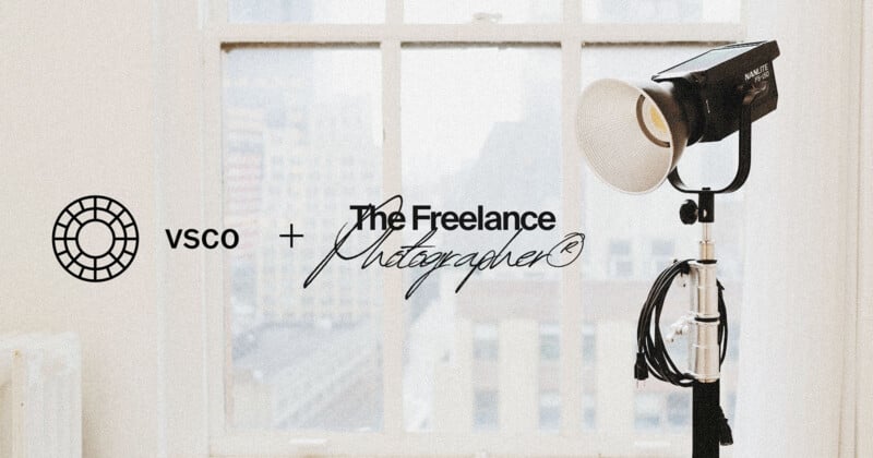 A professional studio light stands near a large window with city buildings visible outside. Overlay text reads "VSCO + The Freelance Photographer" with their logos.