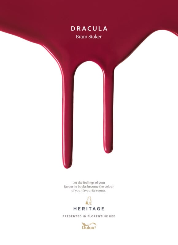 Red paint drips down on a white background, forming the shape of vampire fangs. Above the paint, it reads "Dracula, Bram Stoker." Below is a Dulux Heritage logo with the words: "Let the feelings of your favourite books become the colour of your favourite rooms.