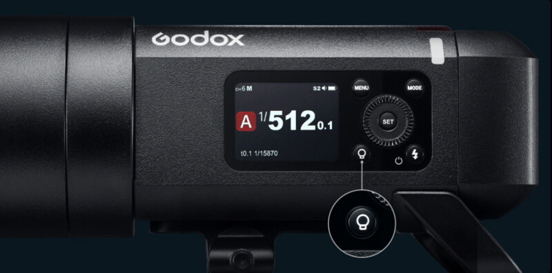 Configuración de visualización de cierre para la unidad de flash de la cámara Godox: Modo A, velocidad de obturación 1/512, potencia 2.1 y botones de control. Un icono resaltado aparece debajo del dial de ajuste.