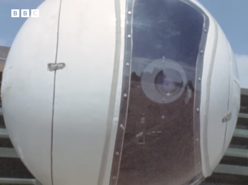A futuristic, spherical white vehicle with a large, clear window showing a person inside. The BBC logo is visible in the top left corner of the image.