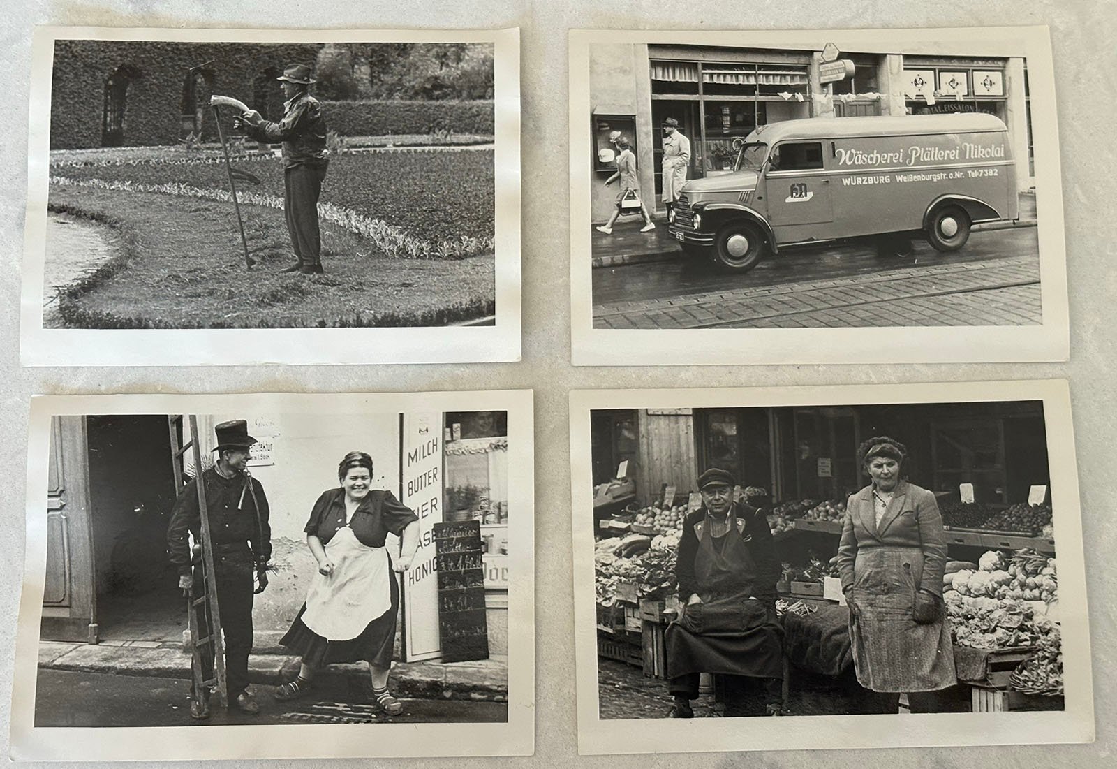 Four vintage black-and-white photos: a man waters a lawn; a woman stands by a delivery van; two people pose outside a shop; two women stand in front of a market stall with produce.