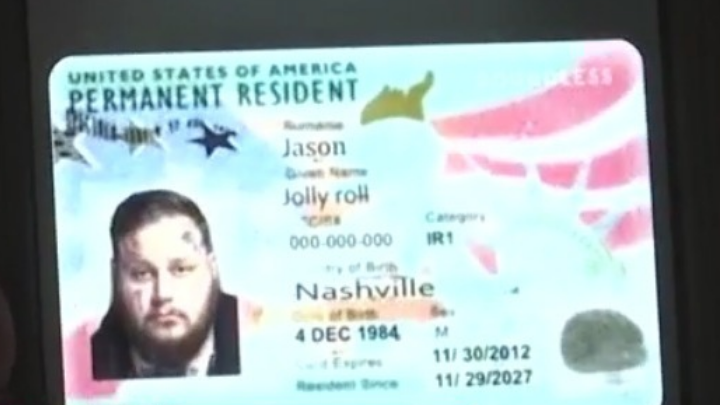 A photo of a U.S. Permanent Resident Card featuring a man’s portrait, the name Jason, and birthplace Nashville. Details like birth date, card numbers, and validity dates are visible on the card.