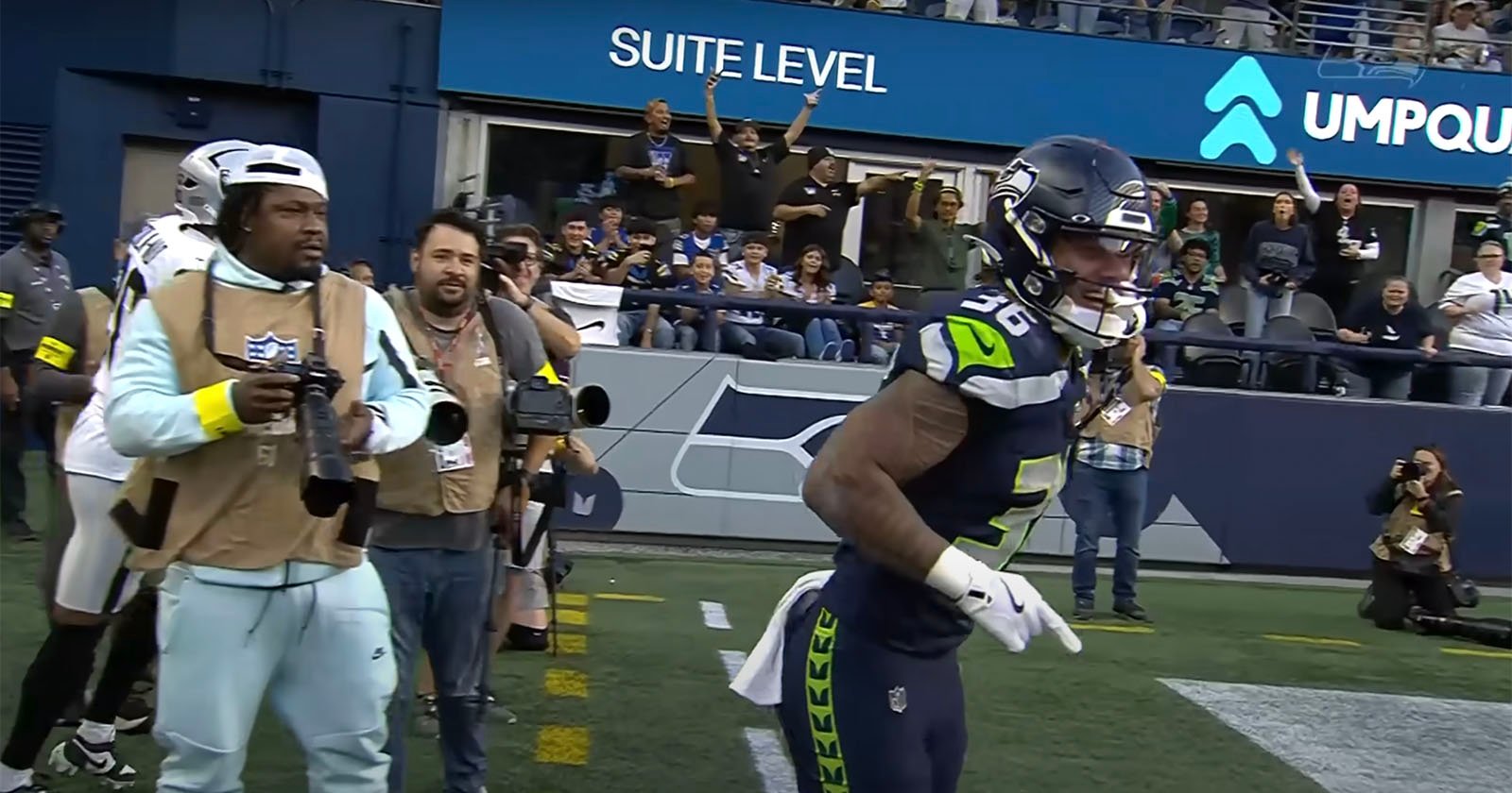 Former NFL Running Back Marshawn Lynch Spotted in Official Photographer Role