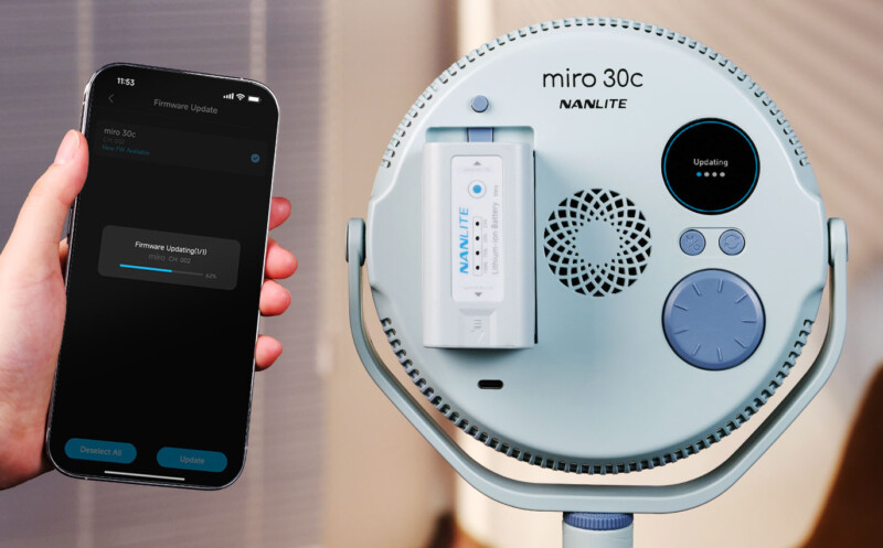 A hand holds a smartphone displaying a firmware update screen, pointed at the back of a Nanlite Miro 30c LED light unit, which also shows an "updating" status on its circular display.