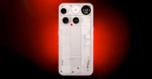 A transparent smartphone with visible internal components is centered on a red and black gradient background, featuring three rear camera lenses and a minimalist design.