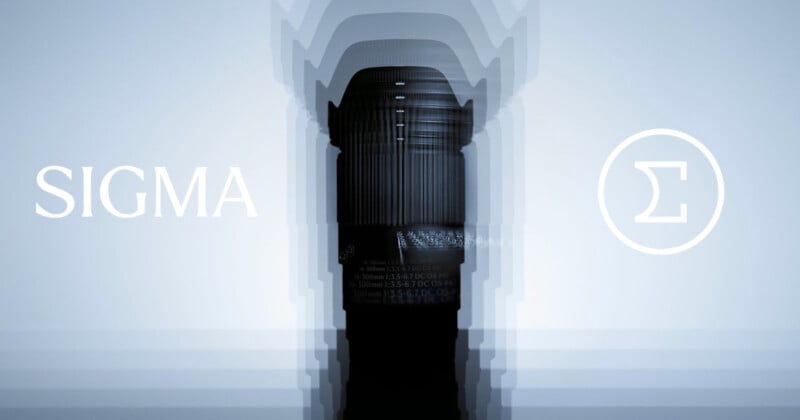 A Sigma camera lens stands upright in the center with a layered blur effect. "SIGMA" is written on the left and the Sigma logo (Greek letter sigma) in a circle appears on the right, all on a light blue background.