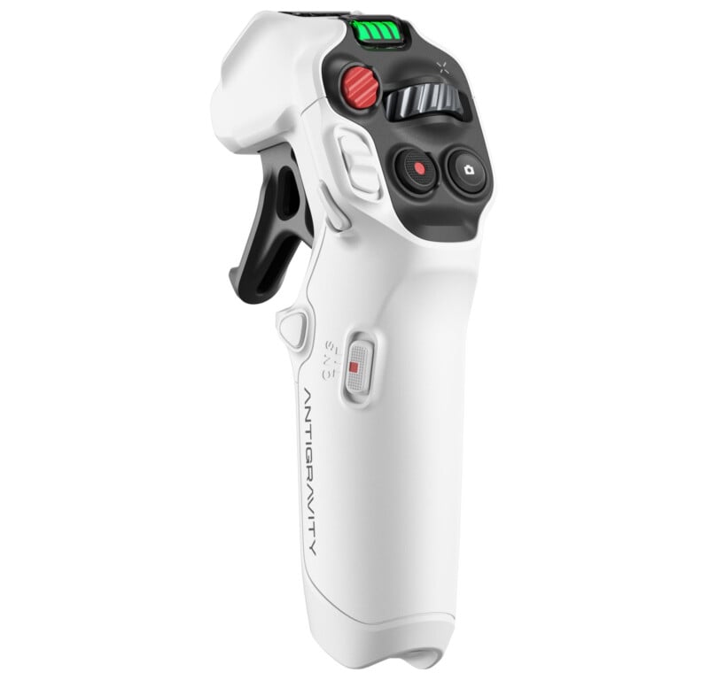 A white, ergonomic gaming joystick controller with multiple buttons, switches, and a thumbstick, labeled “ANTIGRAVITY” on the side, shown standing upright on a white background.