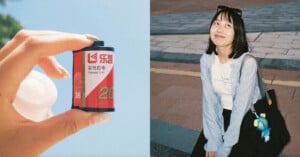 A person holds a 35mm film canister outdoors; next to it, a young woman with glasses and a plush keychain sits on the ground, smiling and looking up on a sunny day.