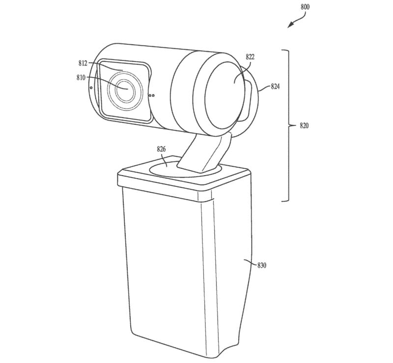 Line drawing of a webcam device showing labeled components, including a camera lens, cylindrical body, mounting arm, and rectangular base. Various parts are annotated with numbers for reference.