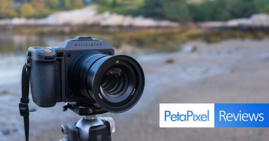 A Hasselblad camera mounted on a tripod outdoors, with a blurred natural background. The image features the Petapixel Reviews logo in the bottom right corner.